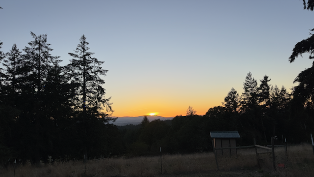Panoramic sunset view across valley